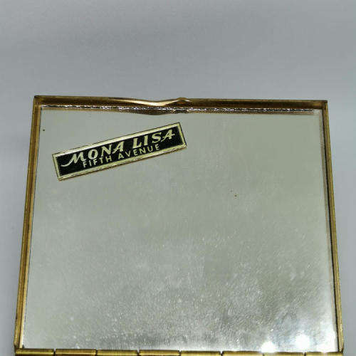 Mona Lisa powder box with hundreds of stars on lid - mirror inside