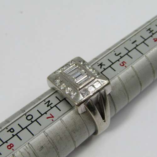 18kt Gold ring with 3 Baguette diamonds and 14 side diamonds - total of about 2ct - weighs 8,3g