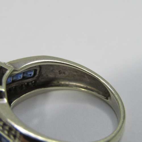 9kt white gold ring with 36 small diamonds plus 7 blue sapphires - weighs 4,3g - size N