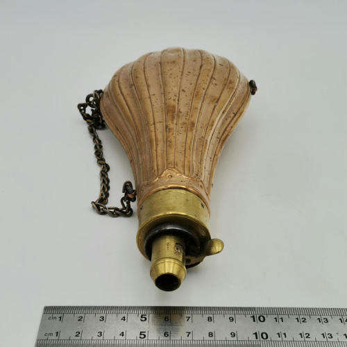 Antique red and yellow copper gun powder flask