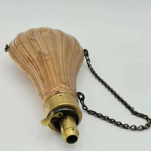 Antique red and yellow copper gun powder flask