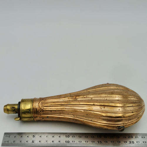 Antique red and yellow copper gun powder flask