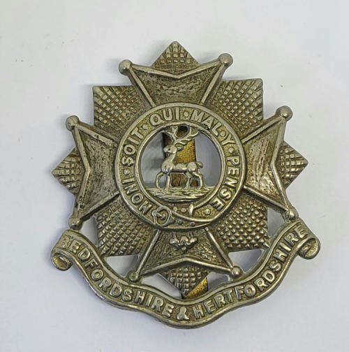 Royal Army Bedfordshire and Hertfordshire regiment cap badge with slide