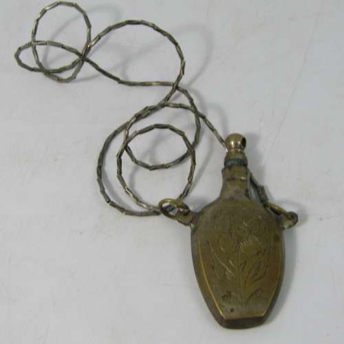 Antique brass perfume bottle on string necklace
