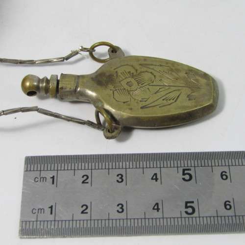 Antique brass perfume bottle on string necklace