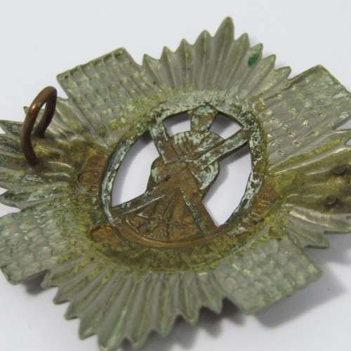 British The Royal Scots cap badge - one lug