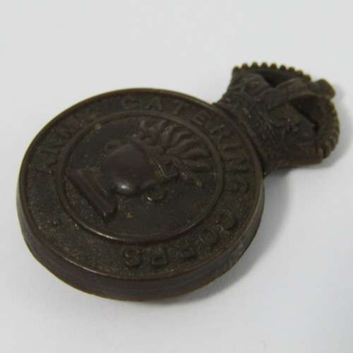 British Army Catering Corps bakelite badge with fold-over clips