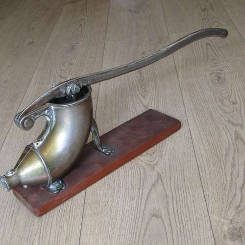 Vintage sausage press with spout