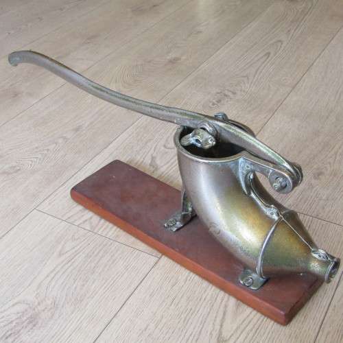 Vintage sausage press with spout