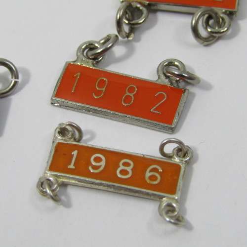 Lot of 1989 Total Milligan vintage trial badges