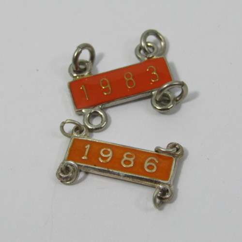 Lot of 1989 Total Milligan vintage trial badges