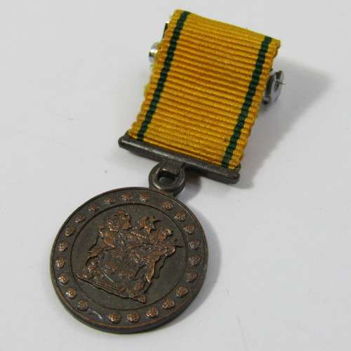 SA Prison Service Faithfull service medal issued to 15425-C Lt. EA de Brauwere with miniature