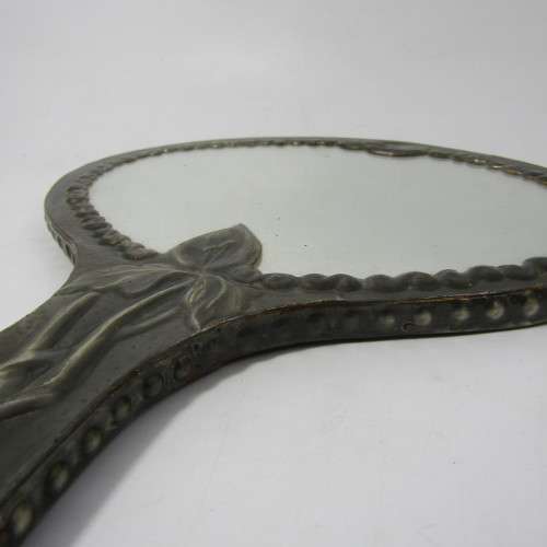 Antique  Pewter hand mirror with flower patterns
