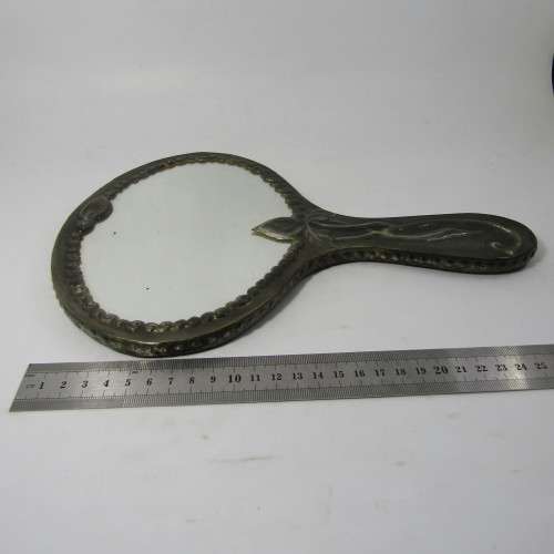 Antique  Pewter hand mirror with flower patterns