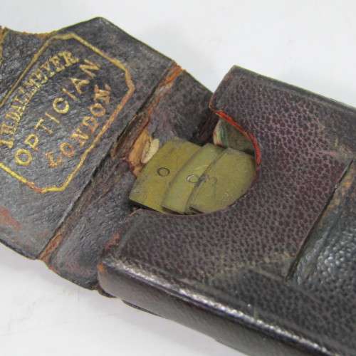 Set of 5 Antique Bruss aperture slides in leather case