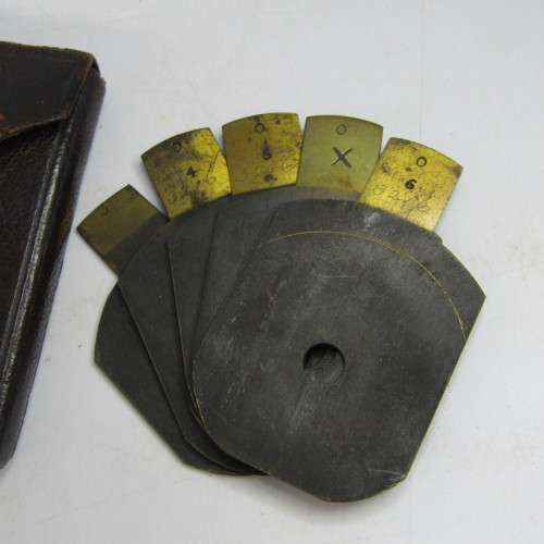 Set of 5 Antique Bruss aperture slides in leather case