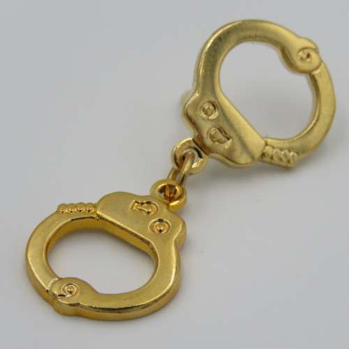 Police handcuffs pin badge