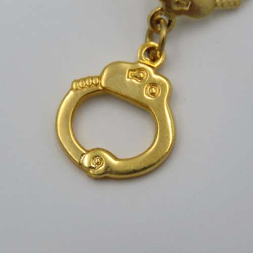 Police handcuffs pin badge