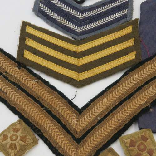 Large lot of military rank badges