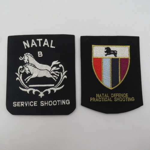 Pair of old Natal shooting cloth blazer badges