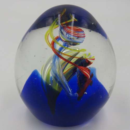 Handmade glass paperweight with spiral design
