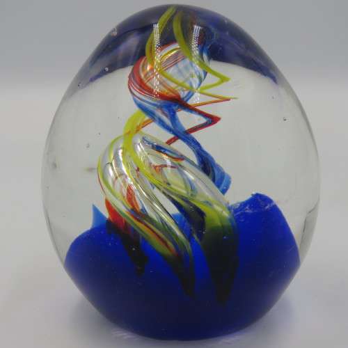 Handmade glass paperweight with spiral design
