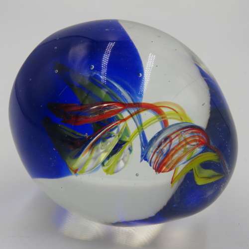 Handmade glass paperweight with spiral design