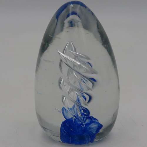 Handmade glass paperweight with spiral design