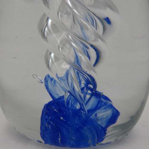 Handmade glass paperweight with spiral design