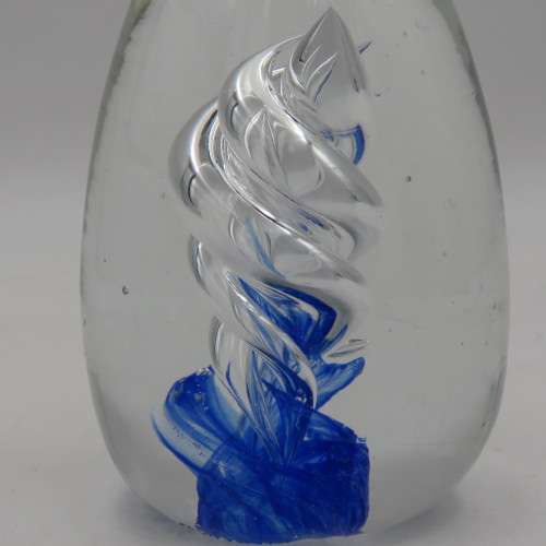 Handmade glass paperweight with spiral design