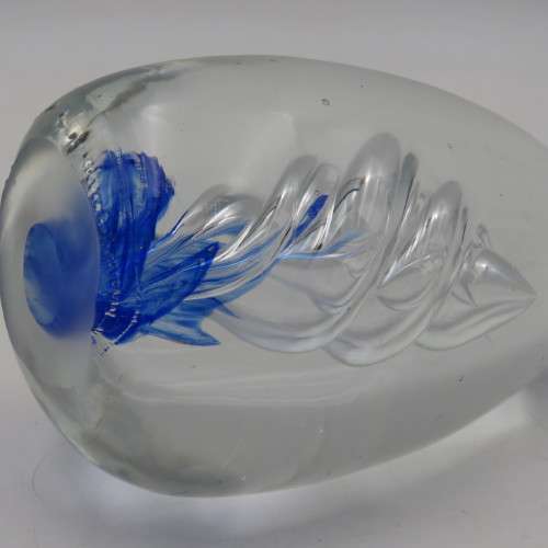 Handmade glass paperweight with spiral design