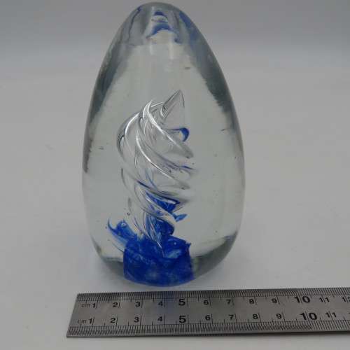 Handmade glass paperweight with spiral design