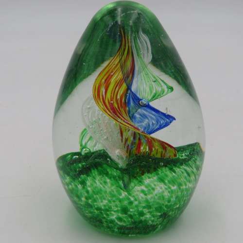 Handmade glass paperweight with spiral design