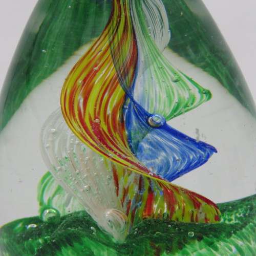 Handmade glass paperweight with spiral design