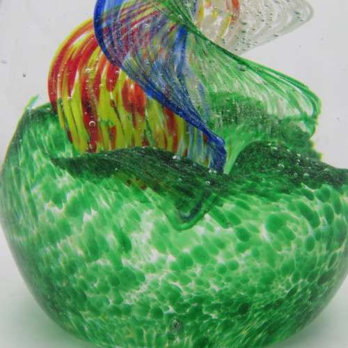 Handmade glass paperweight with spiral design