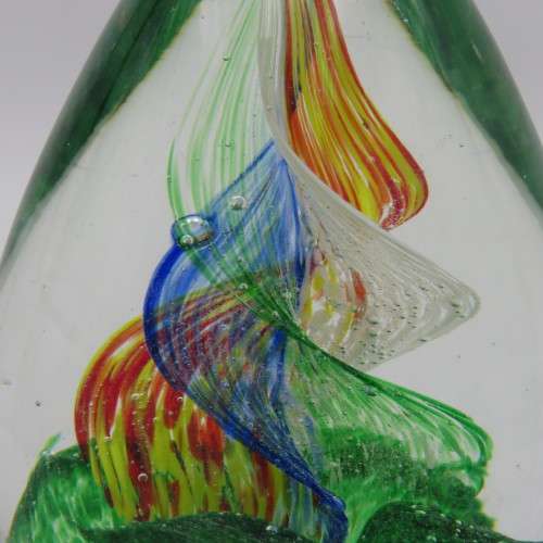 Handmade glass paperweight with spiral design