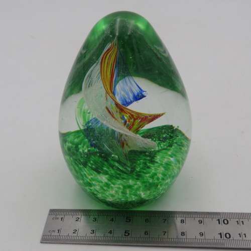 Handmade glass paperweight with spiral design