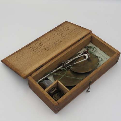 Antique pocket balancing scale with weights