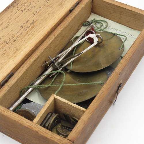 Antique pocket balancing scale with weights
