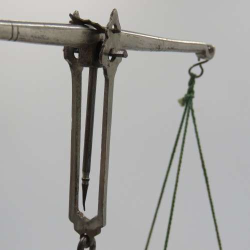 Antique pocket balancing scale with weights