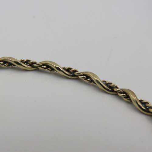 9kt Gold twisted bangle - weighs 4,3 g size - 19 cm