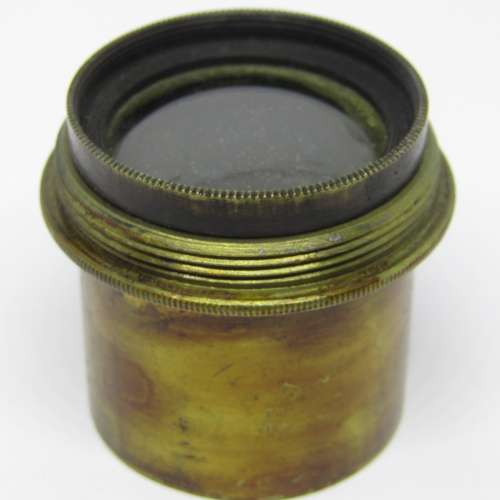 Antique brass camera lens with rotating aperture f11 to f44