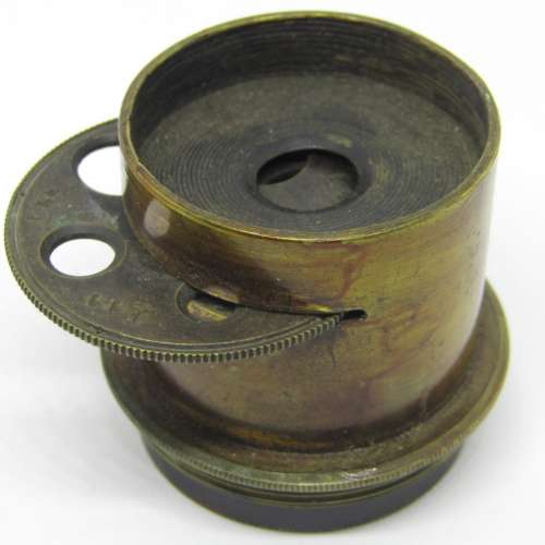 Antique brass camera lens with rotating aperture f11 to f44