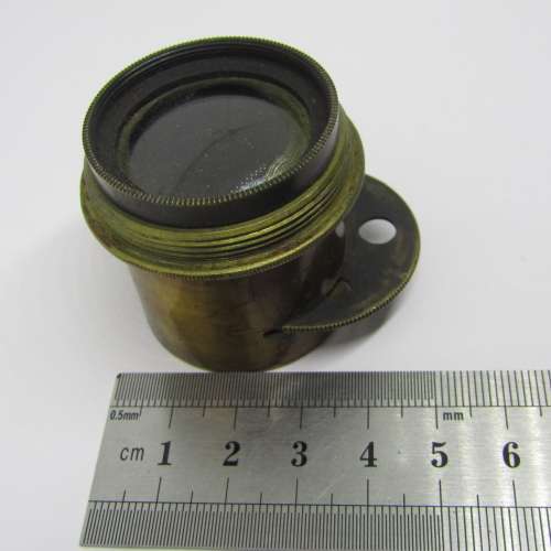 Antique brass camera lens with rotating aperture f11 to f44