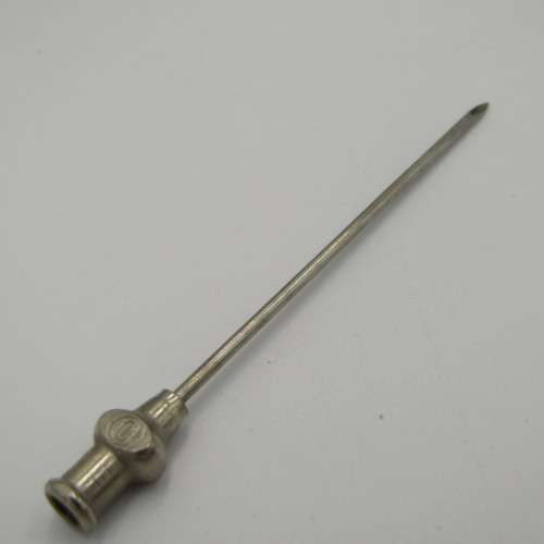 Vintage glass syringe set in metal tin