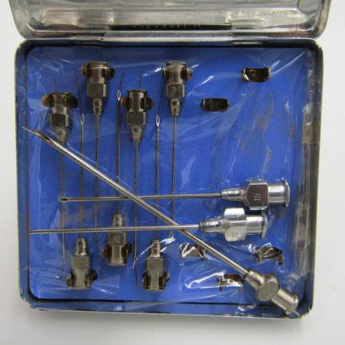 Vintage glass syringe with sealed Anacap Silk stitches in glass tubes