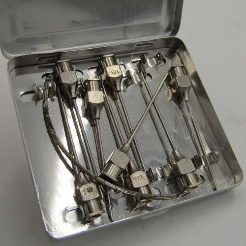 Vintage glass syringe with sealed Anacap Silk stitches in glass tubes