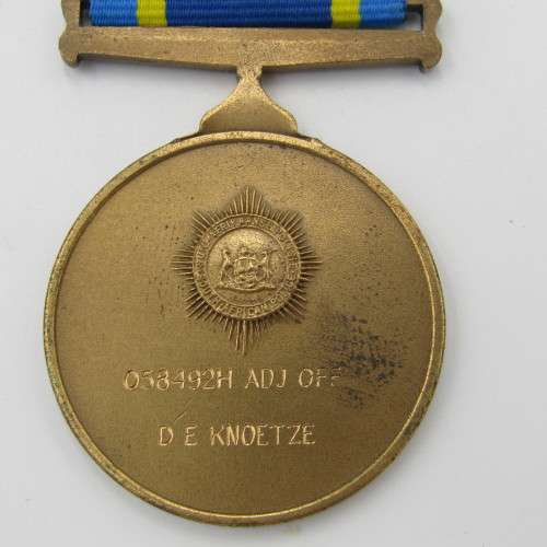 SA Police 75 Years commemorative medal issued to 058492H Adj Off DE Knoetze