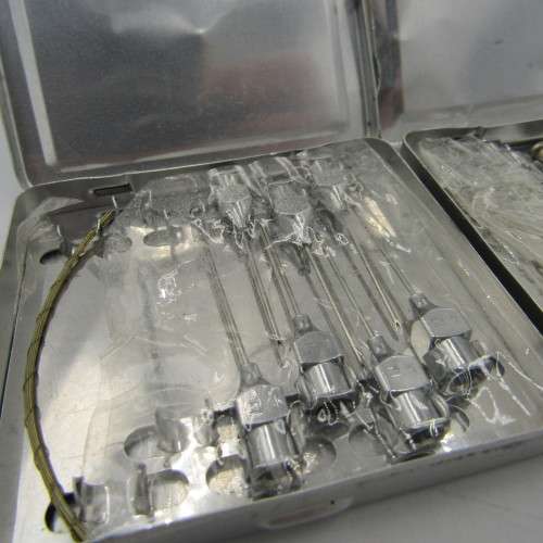 The New Everett glass syringe in box with 2 tins of needles