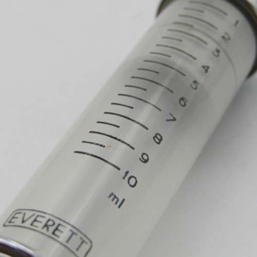The New Everett glass syringe in box with 2 tins of needles
